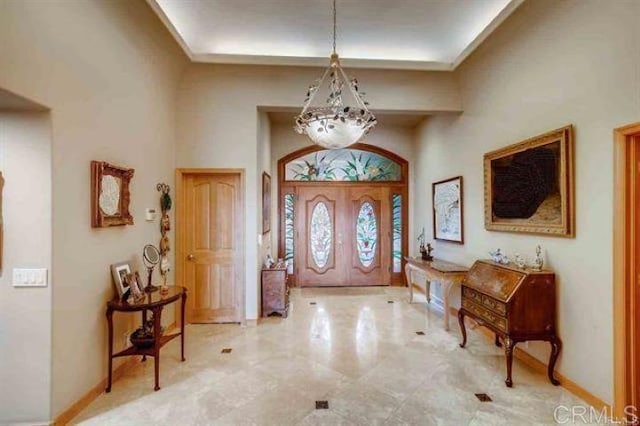 entryway with a high ceiling