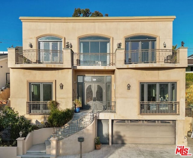 view of front of property with a garage