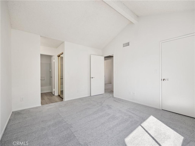 19810 Sandpiper Pl Unit 22, Newhall, CA 91321 - unfurnished bedroom with carpet floors, baseboards, lofted ceiling with beams, and visible vents