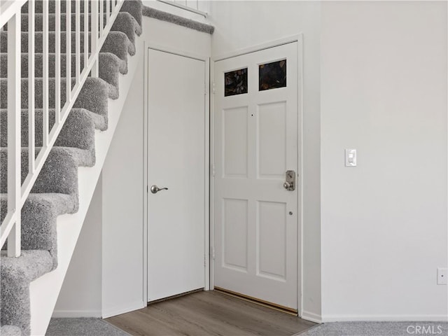 19810 Sandpiper Pl Unit 22, Newhall, CA 91321 - foyer featuring baseboards, stairs, and wood finished floors