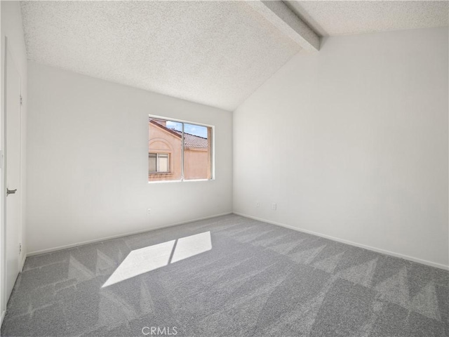 carpeted spare room with lofted ceiling with beams and a textured ceiling