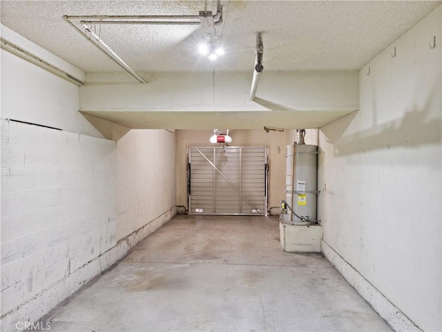 garage with water heater and a garage door opener