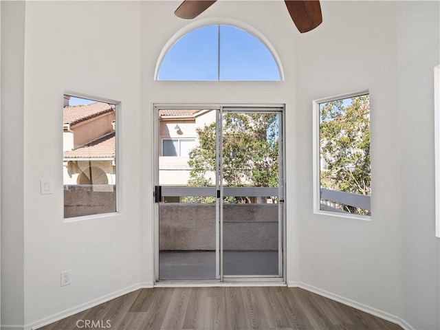 19810 Sandpiper Pl Unit 22, Newhall, CA 91321 - doorway to outside with a high ceiling, a ceiling fan, and wood finished floors