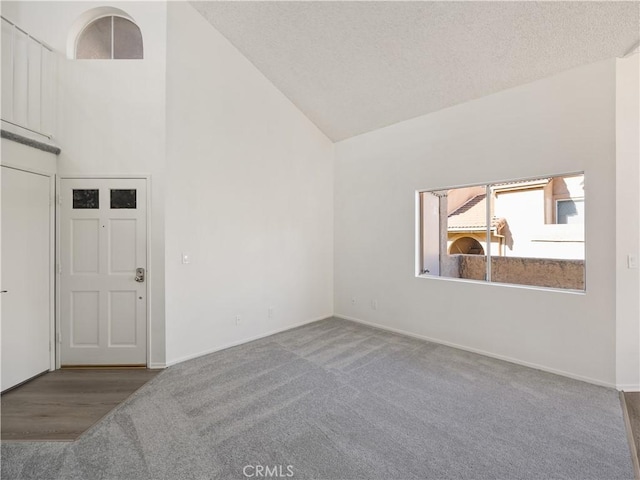 19810 Sandpiper Pl Unit 22, Newhall, CA 91321 - unfurnished room featuring high vaulted ceiling, baseboards, and carpet flooring