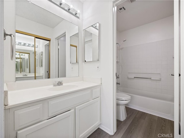 19810 Sandpiper Pl Unit 22, Newhall, CA 91321 - full bath featuring visible vents, vanity, wood finished floors, toilet, and washtub / shower combination