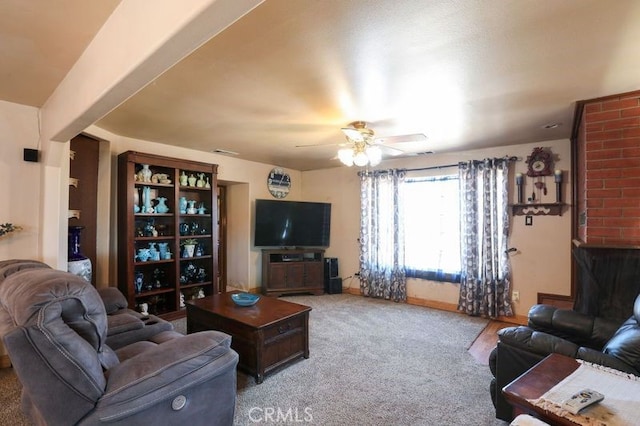 living room with ceiling fan and carpet floors