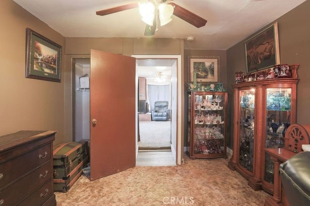 office space with light carpet and ceiling fan