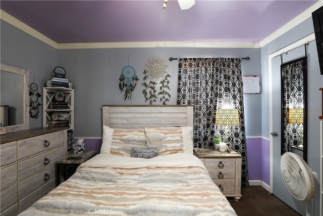 bedroom with a closet and ornamental molding