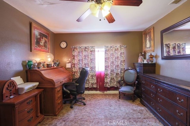 home office with ceiling fan and light colored carpet