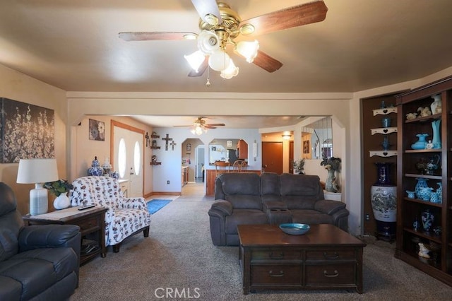 living room featuring ceiling fan and carpet floors