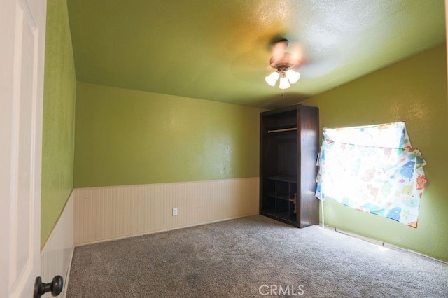 spare room with carpet and a textured ceiling