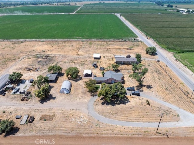 birds eye view of property with a rural view and a water view