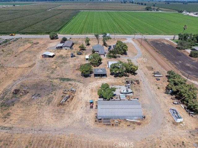 birds eye view of property with a rural view