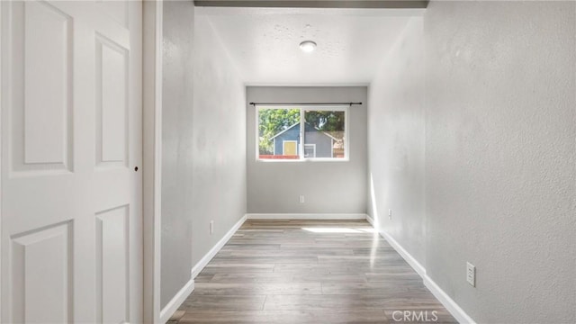 empty room with light hardwood / wood-style flooring