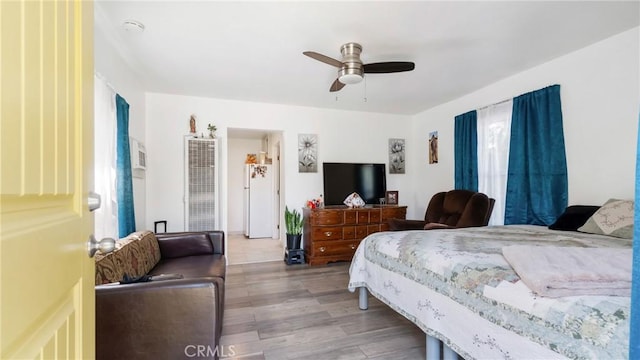 bedroom featuring ceiling fan and light hardwood / wood-style floors