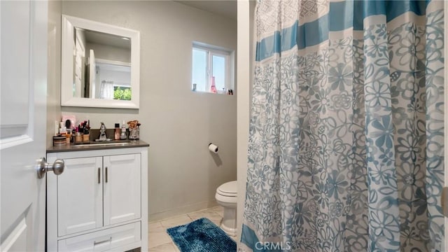 bathroom with toilet, vanity, and a shower with curtain