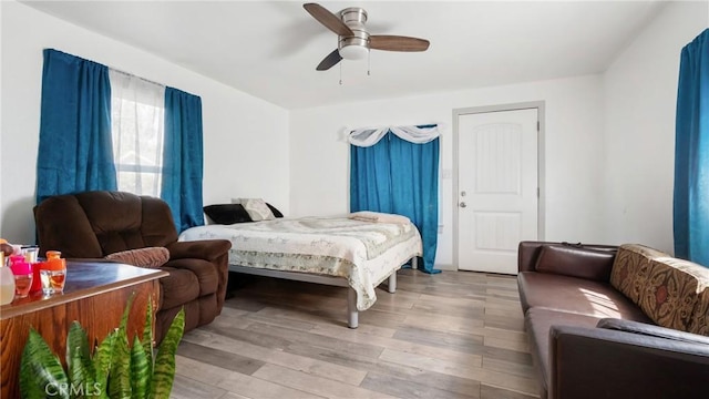 bedroom featuring ceiling fan and wood-type flooring