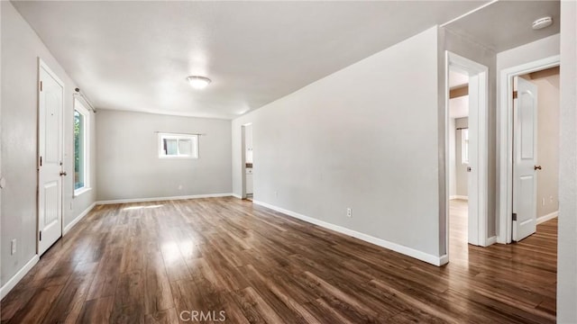 empty room featuring dark wood-type flooring