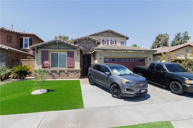 view of front facade with a garage and a front lawn