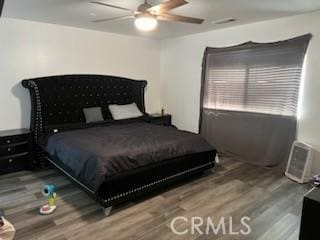 bedroom featuring ceiling fan and wood-type flooring