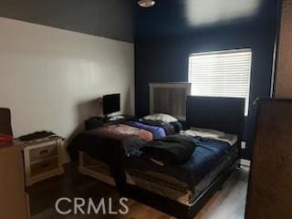 bedroom featuring dark wood-type flooring