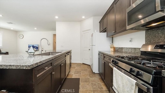 5345 Blue Ridge Way, Fontana, CA 92336 - kitchen with dark brown cabinets, appliances with stainless steel finishes, a sink, and recessed lighting