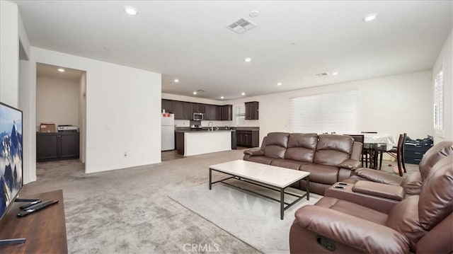 5345 Blue Ridge Way, Fontana, CA 92336 - living area with visible vents, recessed lighting, and light carpet
