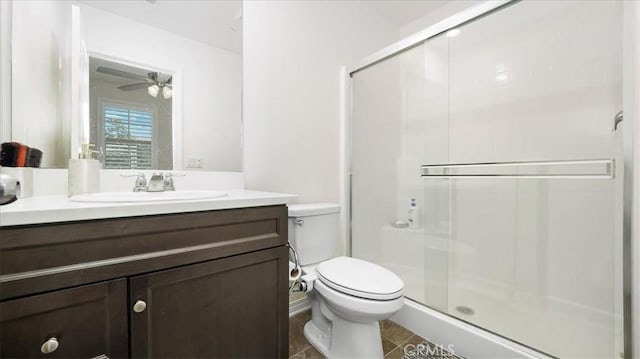 5345 Blue Ridge Way, Fontana, CA 92336 - full bathroom with vanity, toilet, tile patterned floors, a shower stall, and a ceiling fan