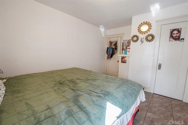 bedroom featuring tile patterned flooring