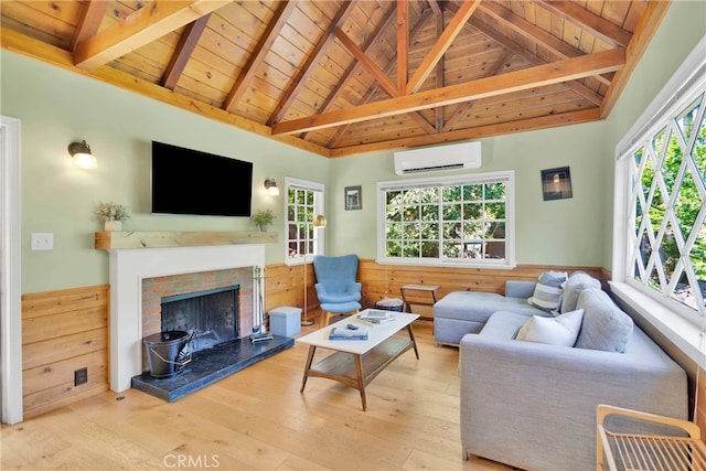 living room with wooden walls, a brick fireplace, light wood-type flooring, wood ceiling, and a wall unit AC