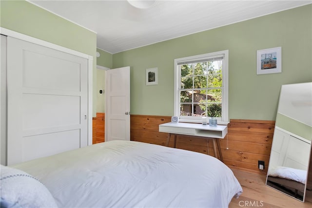 bedroom with hardwood / wood-style flooring