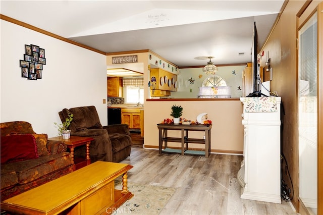 living room featuring lofted ceiling, light hardwood / wood-style floors, and crown molding