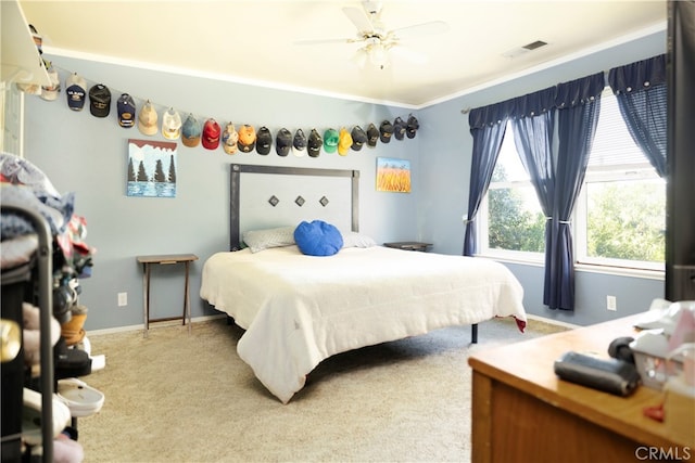 bedroom with carpet, ceiling fan, and ornamental molding