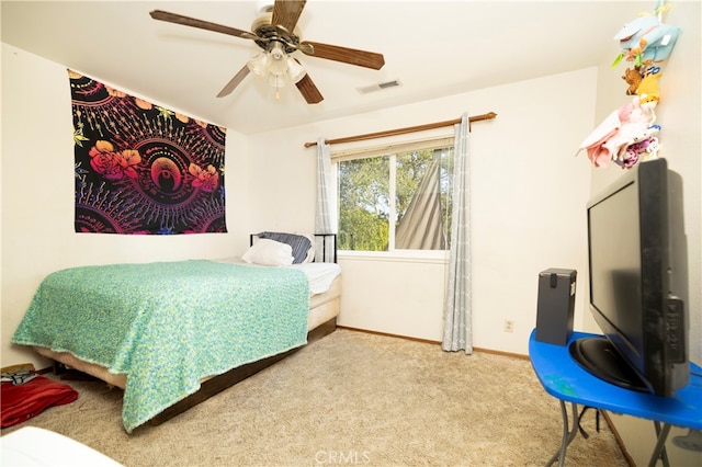 bedroom with ceiling fan and light colored carpet