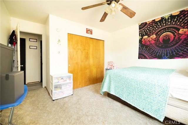 carpeted bedroom featuring ceiling fan