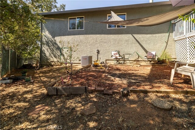 back of house with cooling unit