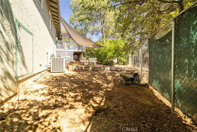 view of yard featuring a patio and central AC unit