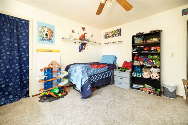 carpeted bedroom featuring ceiling fan