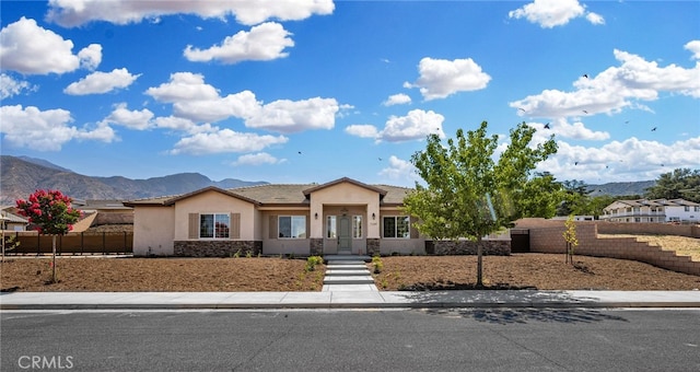 view of front of home featuring a mountain view