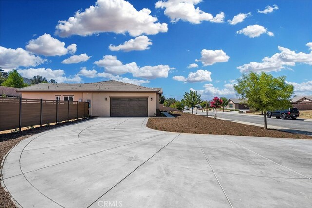 view of side of property with a garage