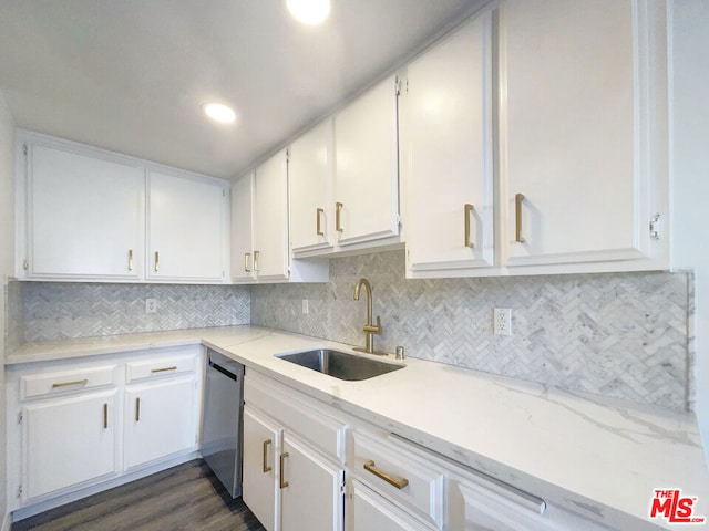 kitchen featuring decorative backsplash, white cabinets, dishwasher, dark hardwood / wood-style flooring, and sink