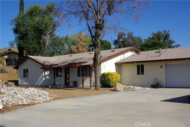 single story home featuring a garage