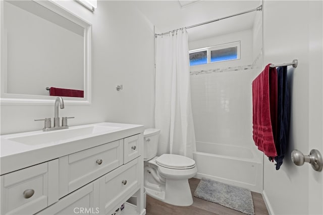 full bathroom featuring vanity, hardwood / wood-style flooring, toilet, and shower / bathtub combination with curtain