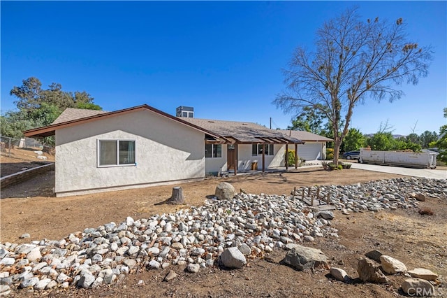 rear view of property featuring a patio