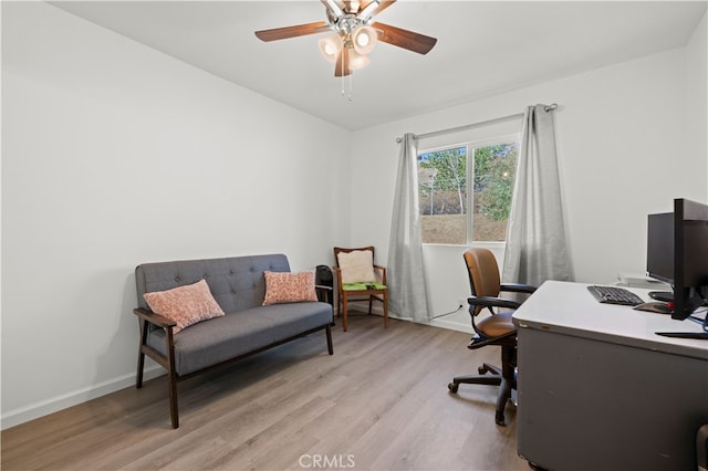 office area with light wood-type flooring and ceiling fan