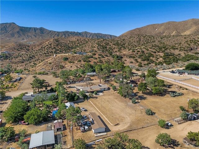 birds eye view of property featuring a mountain view