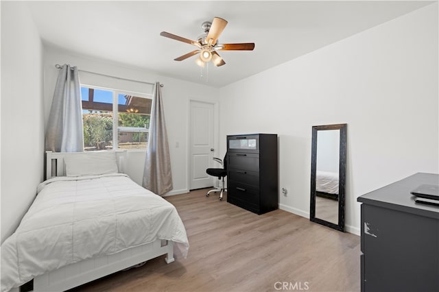 bedroom featuring light wood-type flooring and ceiling fan