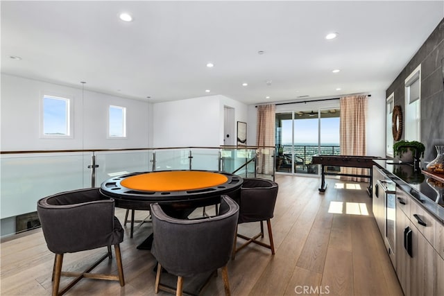 game room featuring light wood-type flooring