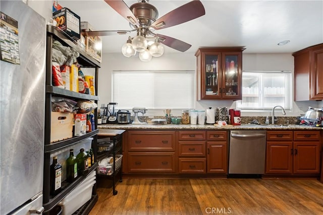 888 Victor Ave Unit 15, Inglewood, CA 90302 - kitchen featuring stone counters, dark wood-style floors, appliances with stainless steel finishes, glass insert cabinets, and a sink