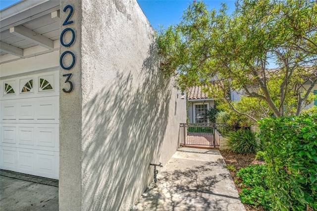 view of side of home with a garage